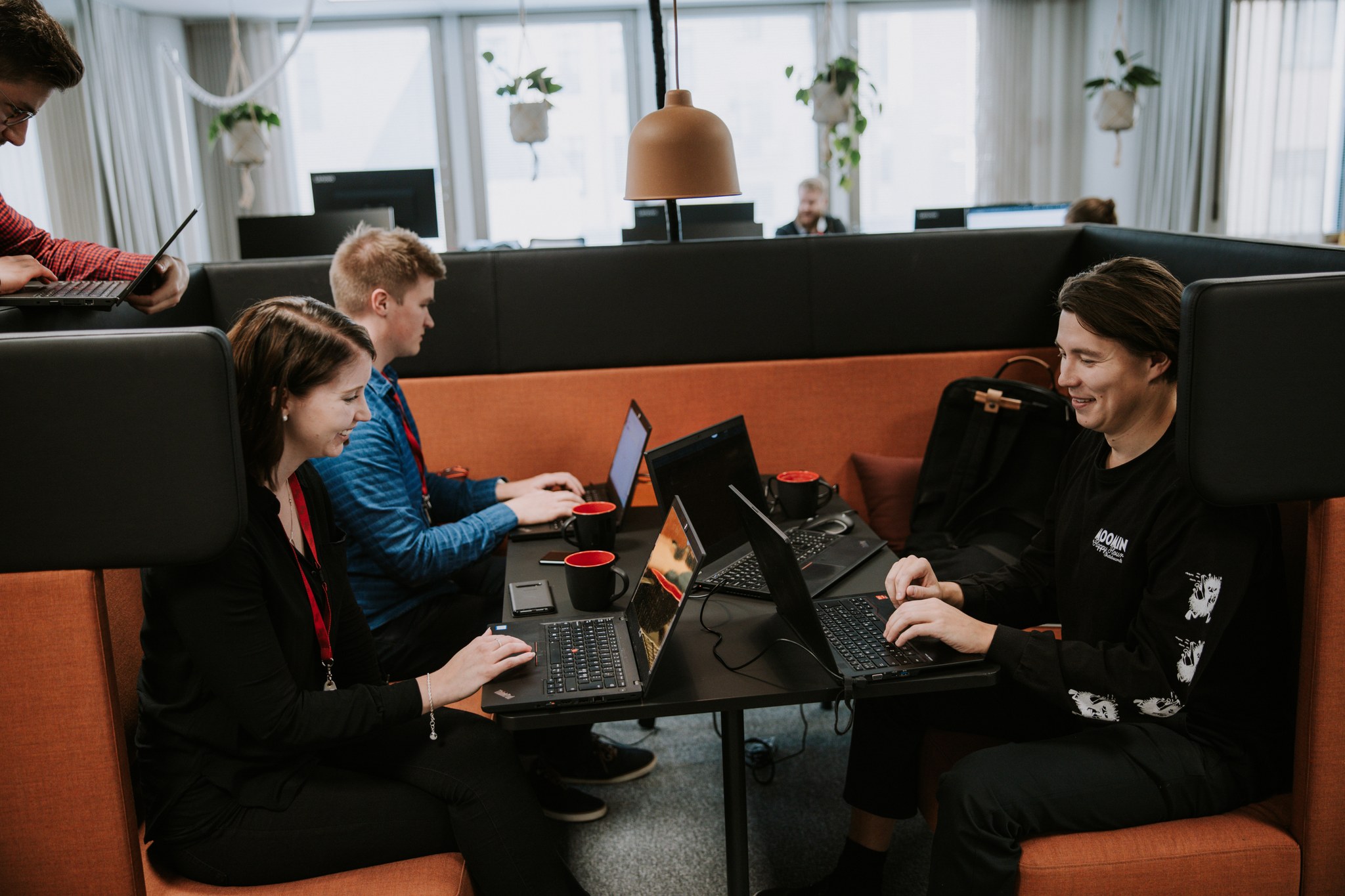 Solitans sitting together at Helsinki office